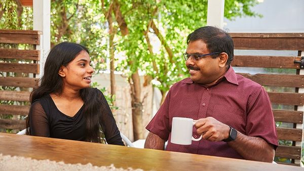 father and daughter smiling and talking.jpg